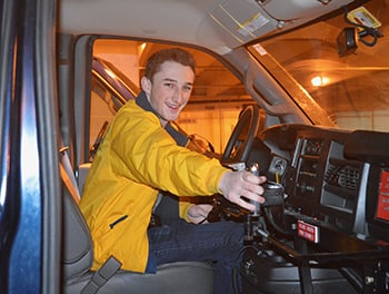 Student driving a van